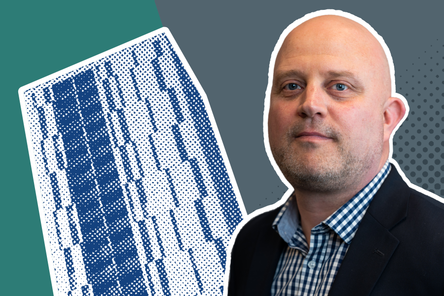 Mark Wilson in front of a blue high-rise building in a halftone pattern