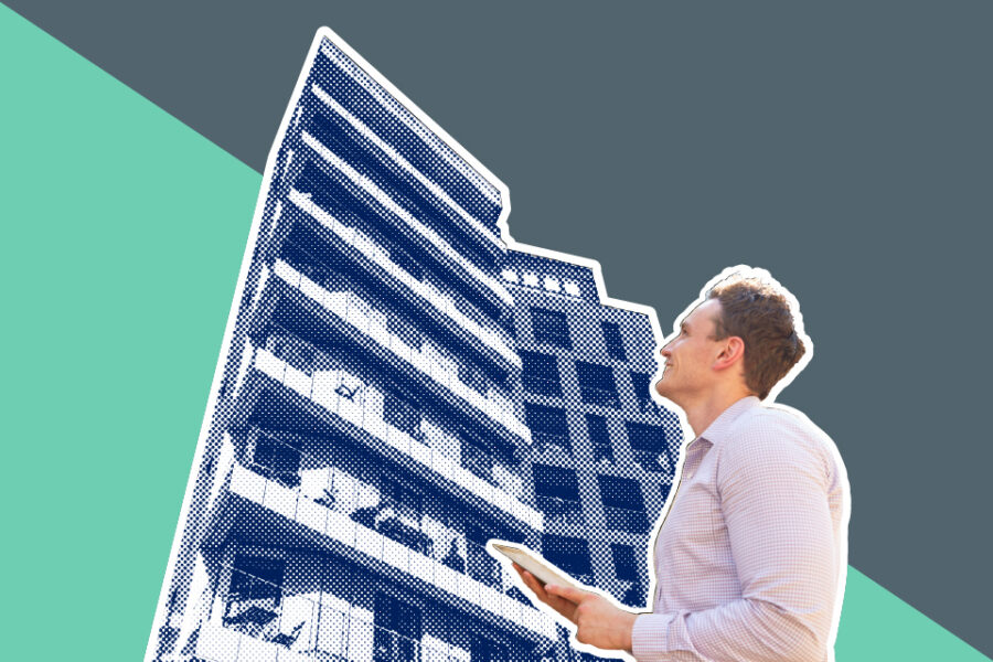 A man looking up, and a digital tablet in his hands