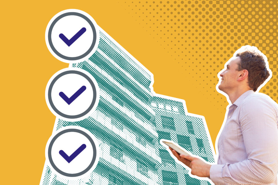A man holding an electronic tablet looking up at a teal high rise building with three ticks to show gateway Three on a yellow background